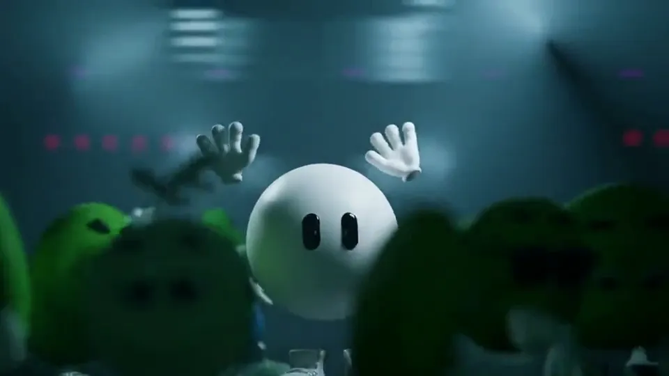 A short animated sign-off: a round white mascot with white gloves waves both hands in a crowd of green characters.